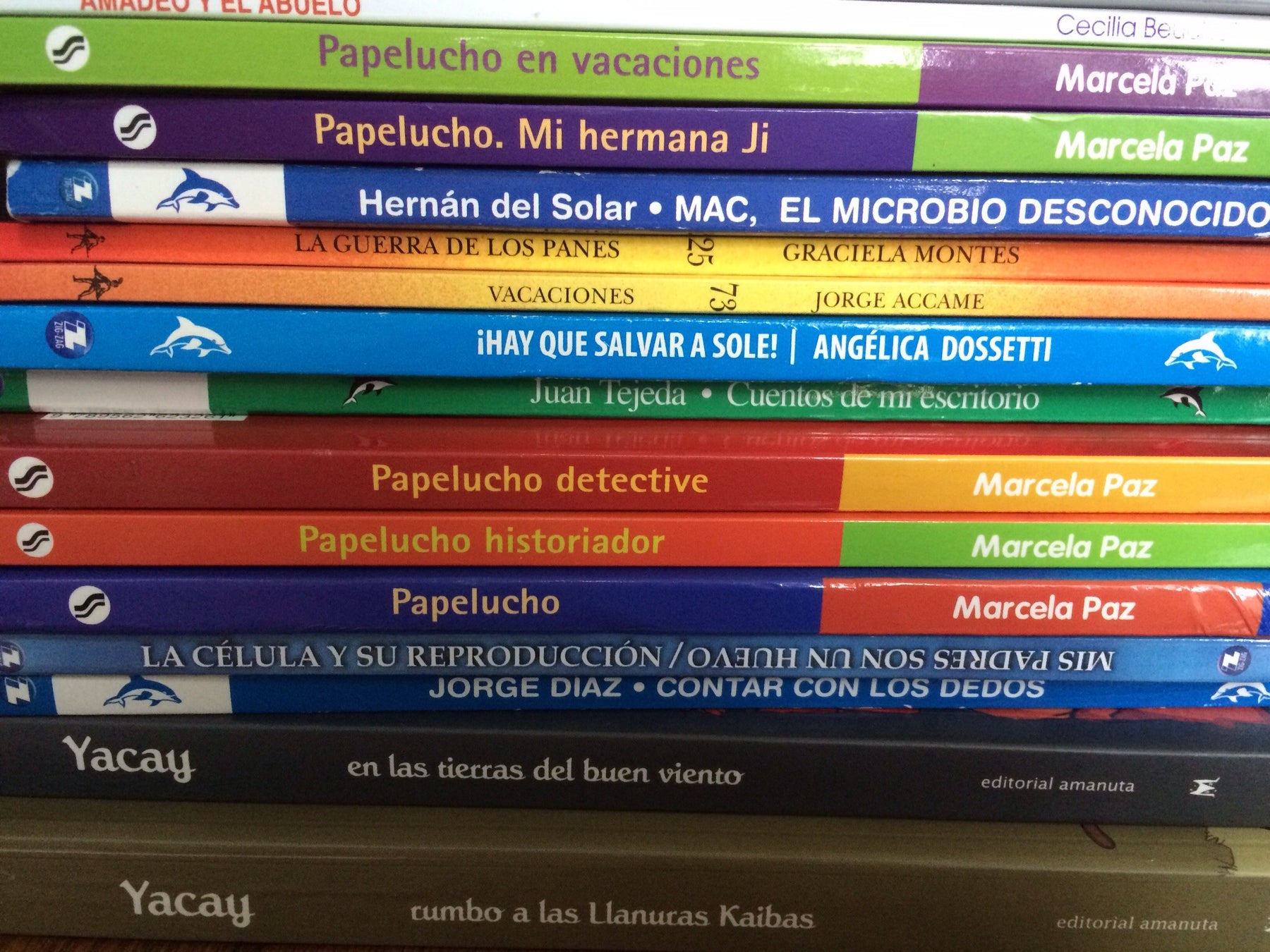image of the spines of a stack of books