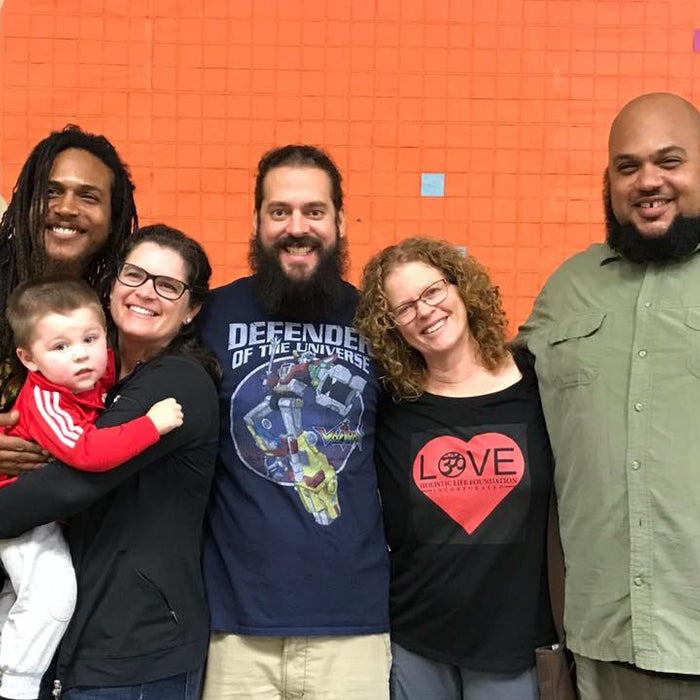 image of Heather and her son with four other people