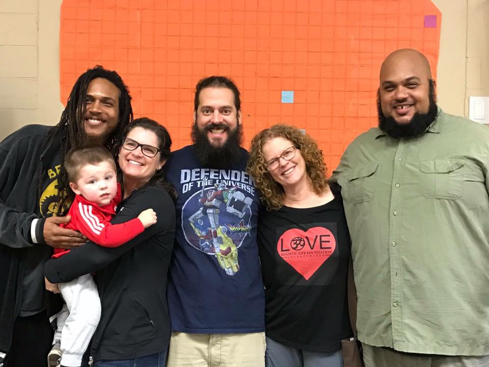 image of Heather and her son with four other people
