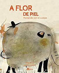 Book cover of A Flor de Piel depicting an image of an elephant with a hat on its head.