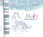Book cover of Hoky el Lobo Solidario with an illustration of a wolf in winter.