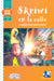 Book cover of Skriwi en la Calle with an illustration of children with shining lights.