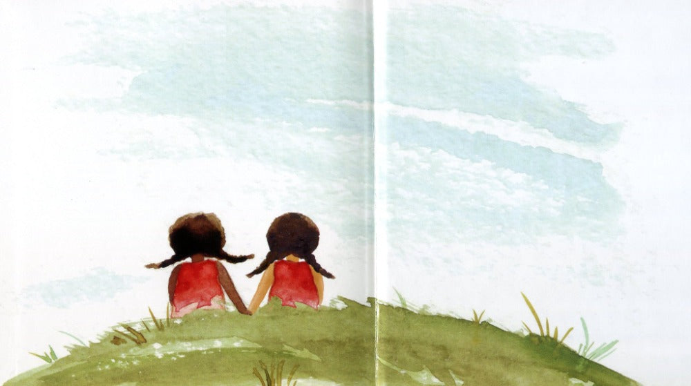 Inside book page illustrates Tamika and a girl sitting in grass.