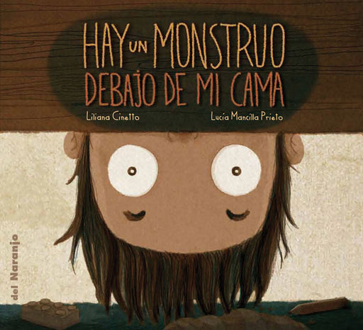 Book cover of Hay un Monstruo Debajo de mi Cama with an illustration of a boy peaking under the bed.