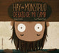 Book cover of Hay un Monstruo Debajo de mi Cama with an illustration of a boy peaking under the bed.