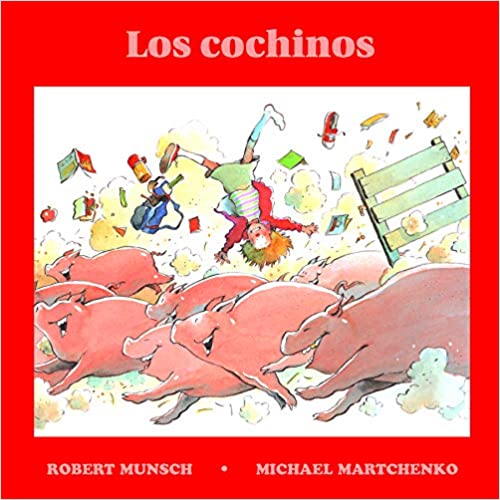 Book cover of Los Cochinos with an illustration of pigs running.